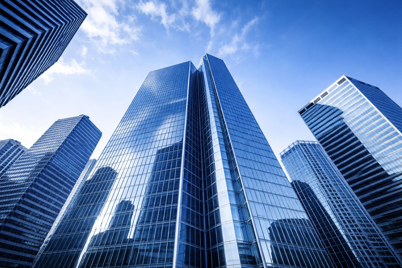 commercial real estate office buildings blue glass skyscrapers upward view